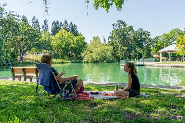 Bellview residents enjoying a beautiful afternoon by the pond at Howe Community Park.