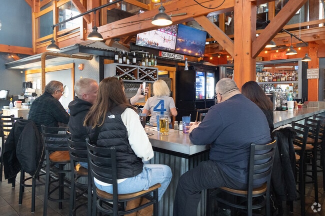 Locals enjoy the afternoon at StockHouse Restaurant and Sandbar Pub in Windham.