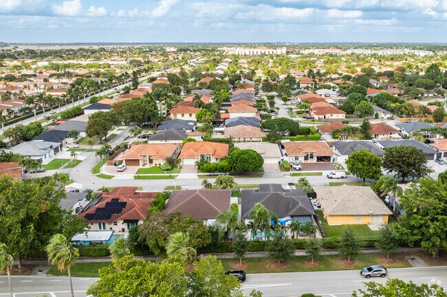 Stucco walls and tile roofs define The Hammocks’ tight-knit Spanish-revival community.