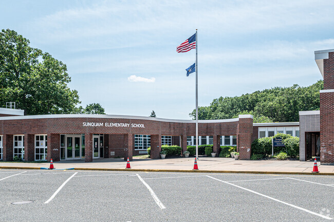 In front of the main entrance of Sunquam Elementary School you will find the bus parking spots.