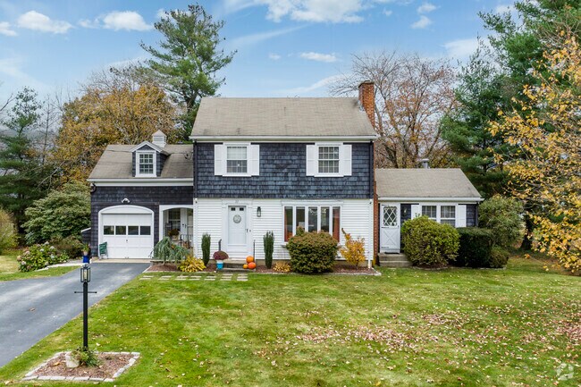 Comstock Gardens residents keep their lawns tidy even as the fall leaves fill their spaces.