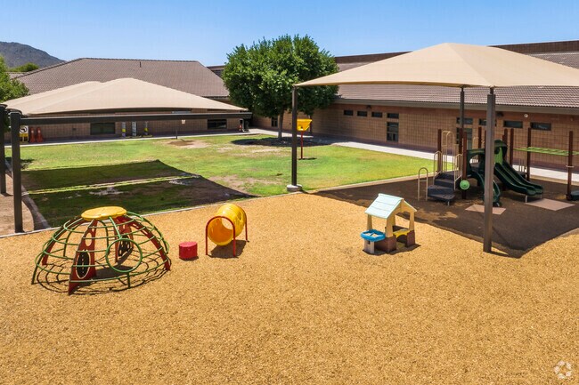 Shaded playgrounds offer relief from the sun during play at Riggs Elementary School.