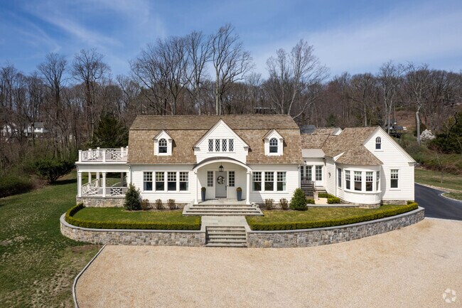 Multiple gorgeous Dutch Colonials overlook Lloyd Harbor proudly.