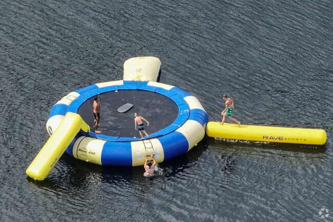 Children enjoy lakeside fun at Mousam Lake in Acton’s summer sunshine.