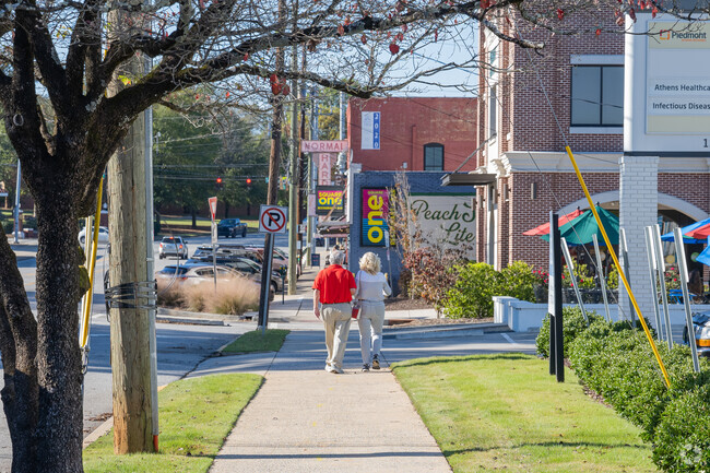 Couples enjoy a stroll in the retail area of the Boulevard community.
