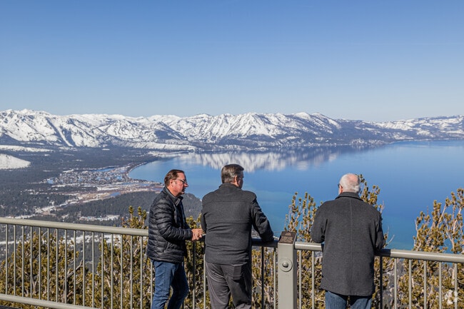 Men enjoy stunning views over South Lake Tahoe, a moment of serenity.