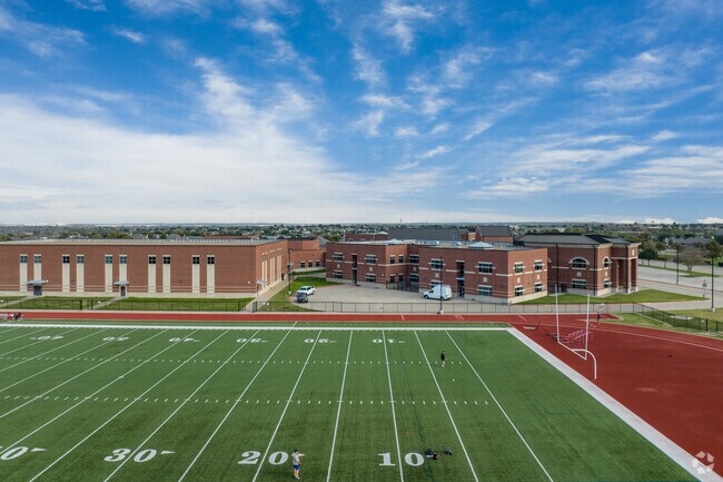 The Truett Wilson Middle School in Haslet Texas has school colors of purple and black.