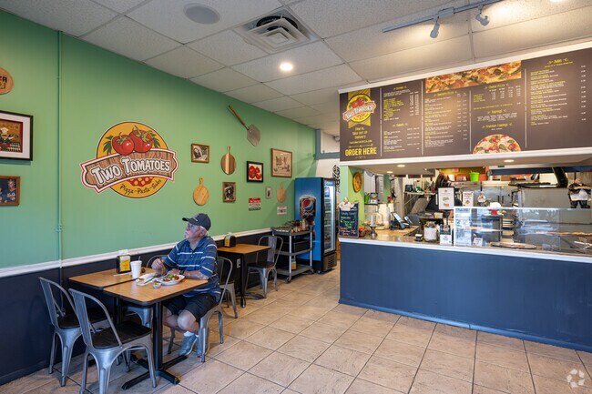 Enjoy New York-style pizza at Two Tomatoes, just minutes from The Cascades.