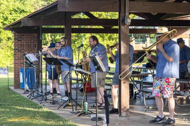 Here a brass band plays for the crowd at Farmington's Music in the Park.