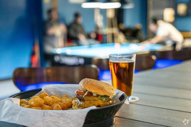 A double burger and a game of pool are the way some Millsboro folks spend an evening.