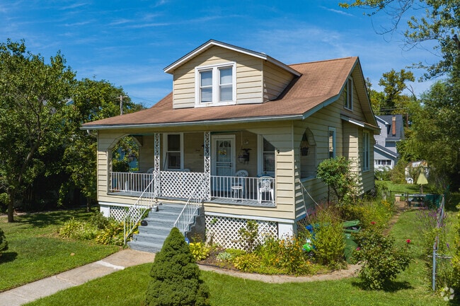 A Bungalow style home with a dormer window and front porch on Rosekemp Ave in Moravia-Walther.
