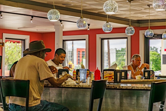 Friends from The Thicket converse over lunch at Jake’s Diner.