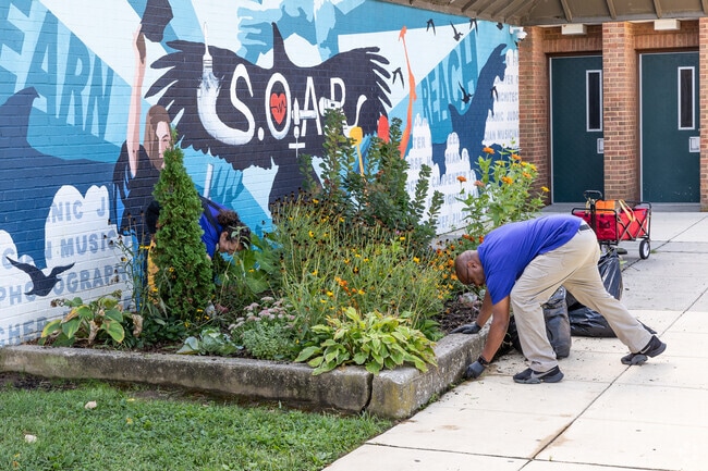Volunteers care for the garden at Morrell Park Elementary/Middle School.