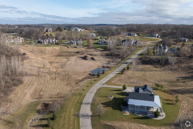 North of Ada on the other side of the Grand River you can find large estates on gated drives.