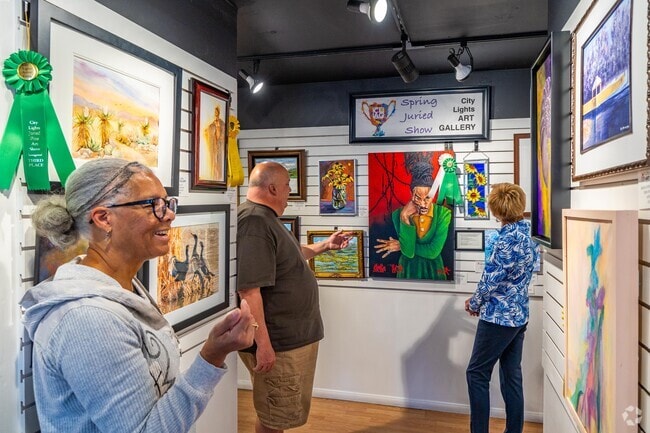 City Lights Art Gallery patrons view local art that is regularly updated and exhibited.
