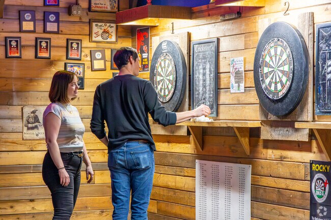 Play a game of darts with friends at Mountain Tap Bar & Grill in Applewood West.