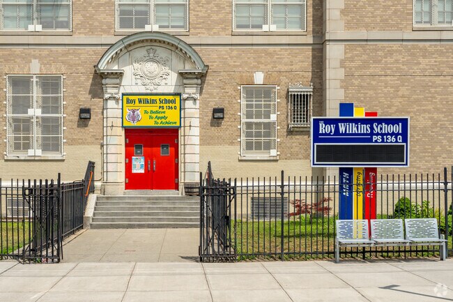The P.S. 136 Roy Wilkins main entrance is located on 115th Ave.