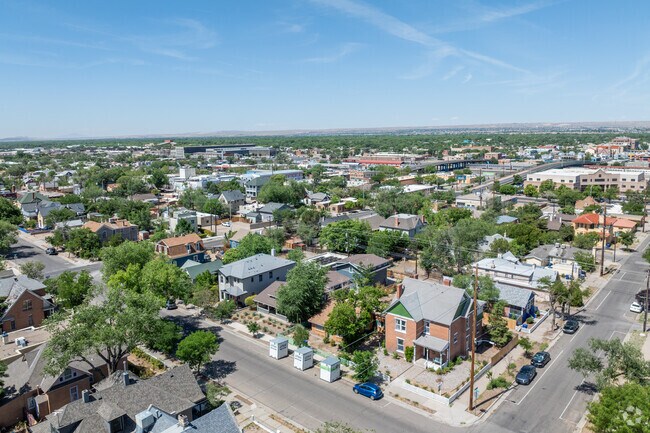 Rooftops and treetops mix in this aerial view of Broadway Central Corridor homes.