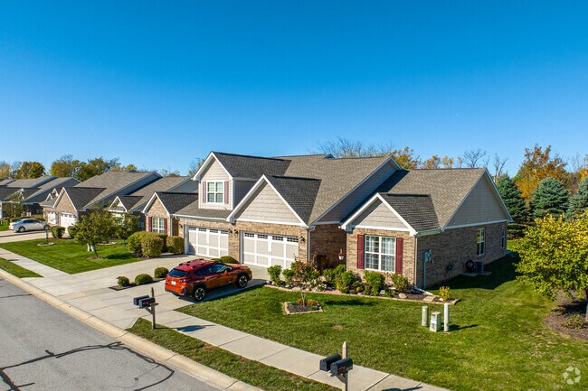 A row of new build American style homes on Lake Forest Dr in Avon.