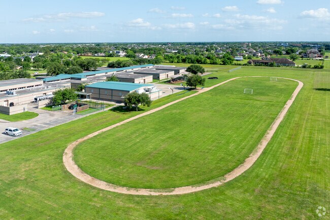 The students of Challenger Elementary School exercise on the track and field.