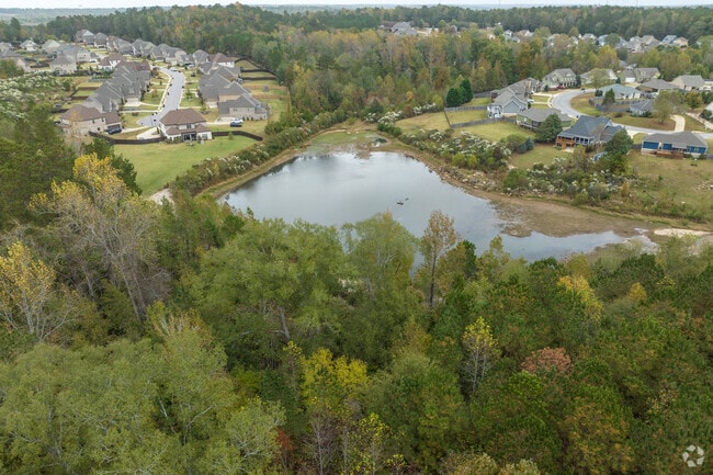 Homes in Willow Creek surround the community lake, and some houses have private docks.
