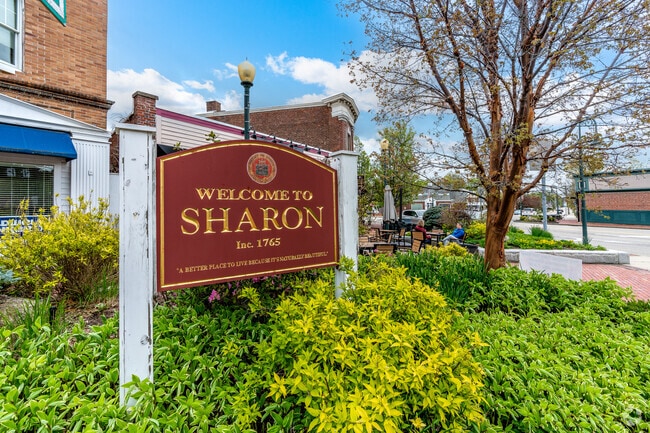 Welcome to Sharon sign is at the corner of Post Office Square and North Main Street in Sharon.