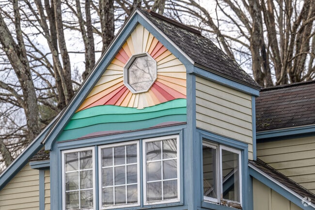 An elegant sunburst pattern in the gable end of a home has fanciful painting in Leeds Village.