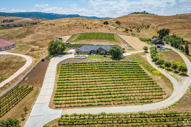 Vineyards surround a stunning property in Hollister, California.