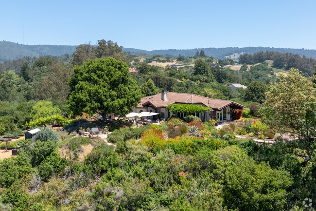 Mediterranean estate in Corralitos blends terracotta roofing with vibrant native gardens.