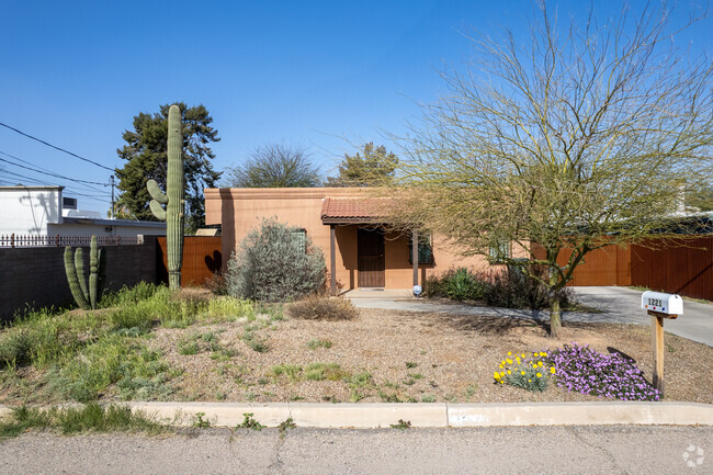 Adorable Adobe Bungalows Are Tucked In Between Brick Homes