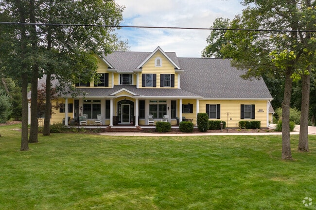Colonial Revival-style homes are typically further from the water in Chenequa.
