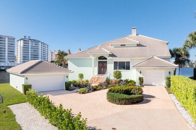 Newly constructed waterfront homes in Vanderbilt Beach are built up higher in elevation.