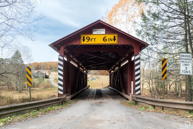 A historic wooden covered bridge adds charm to Pine Township’s scenic countryside.
