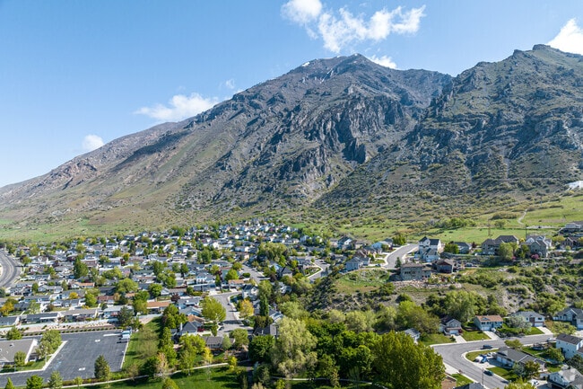 Little Rock Canyon stretches north toward the Wasatch Mountain Range, offering a scenic setting framed by alpine peaks and natural beauty.