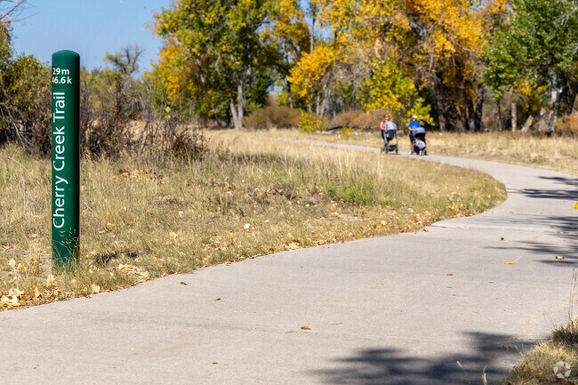 Enjoy a casual stroll with a friend along the Cherry Creek Regional Trail.
