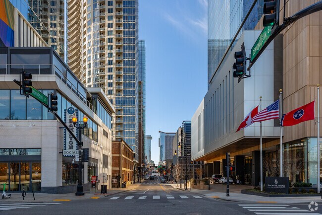 Demonbreun Street runs through SoBro with multiple condo buildings along it.