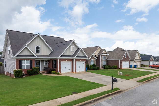Discover the charm of Jacksonville, where beautiful brick homes with garages await you.