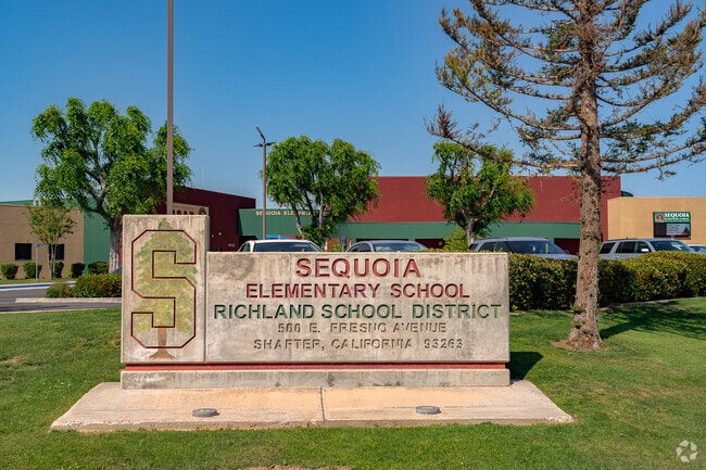 The sign welcomes students and staff as they enter the school.