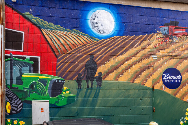 A colorful mural shows an evening on a beautiful Mount Pleasant farm.