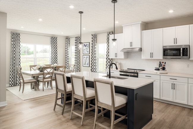 Your new kitchen includes a 6’+ island, upgraded cabinets, quartz countertops and stainless-steel appliances – all included in the base price of your home!