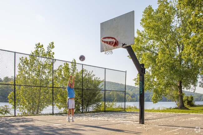 In Lake Carmel, even the basketball courts come with a lake view and room for kids to play until the sun starts to set.