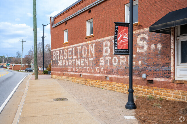 In the charming town of Braselton, numerous historical structures still stand proudly, showcasing their original architectural artwork, which adds a unique character and rich history to the landscape.