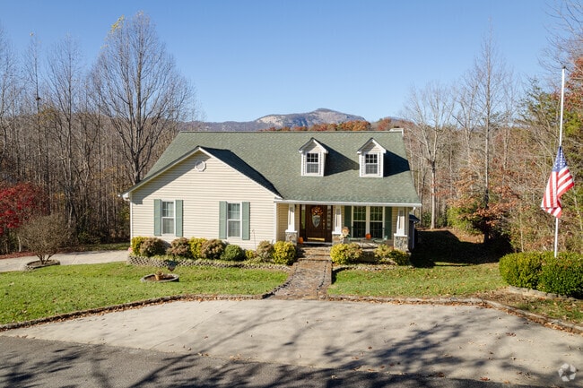 Smaller Tudor style homes with small front yards can occasionally be found in Pumpkintown.