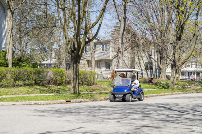 Locals use their golf carts on and off the course in the Clinton-George neighborhood.