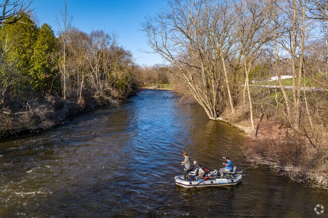 Saukville residents fish along the Milwaukee River as it winds through the village.