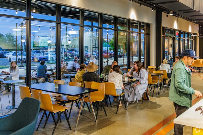 The Stock and Grain Food Hall provides open seating for friends from Festival Park to dine.