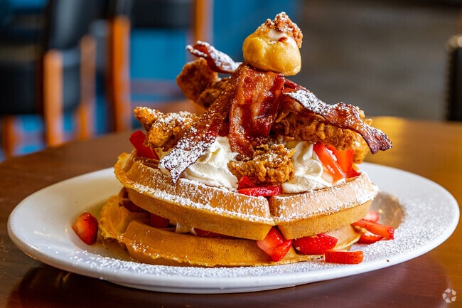 Satisfy your bacon craving with the towering chicken bacon waffles at Bacon Street Diner.
