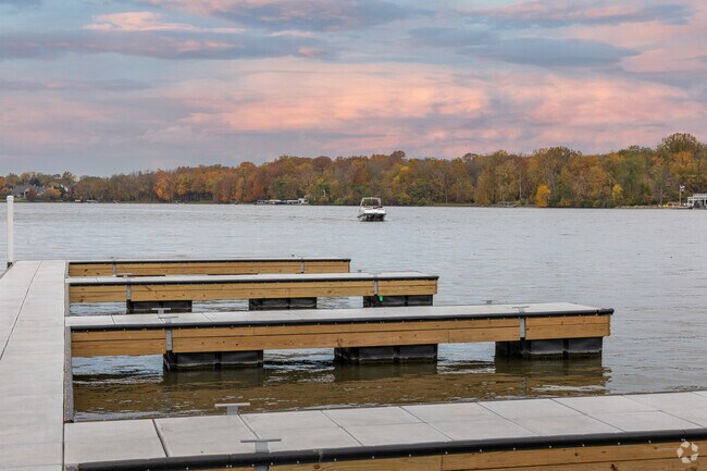 Boaters enjoy an early morning in Pleasant Acres from the shore of Geist Reservoir.