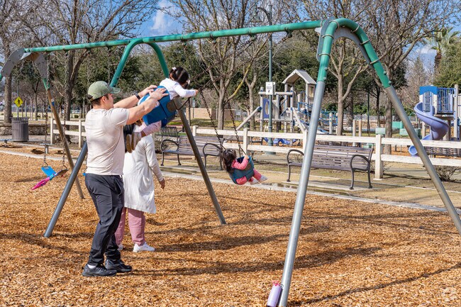 A Shannon Ranch father enjoys pushing his daughter on the swing at a nearby park.