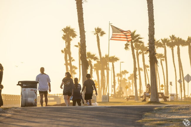 Walk along the shore as the sun goes down in Sunset Beach.